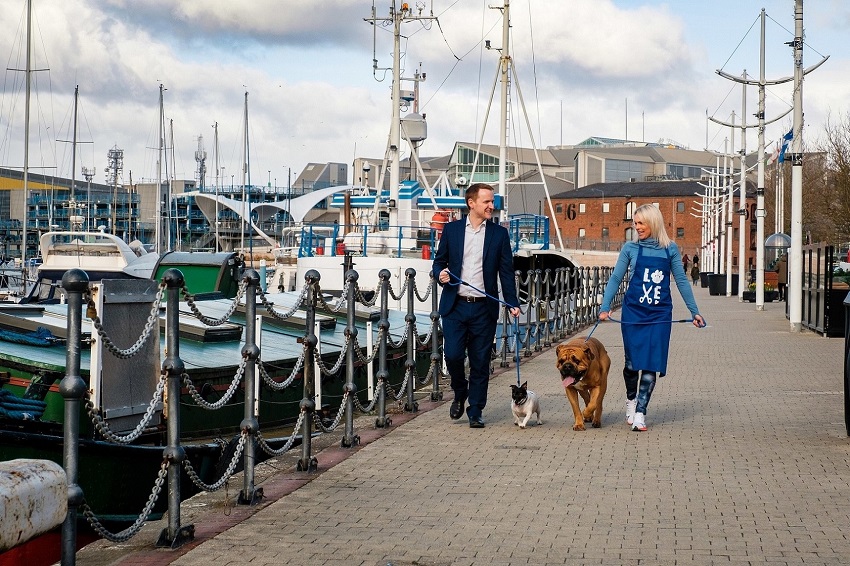Stacey and Tom walk dogs Hooper and Wally along Hull Marina